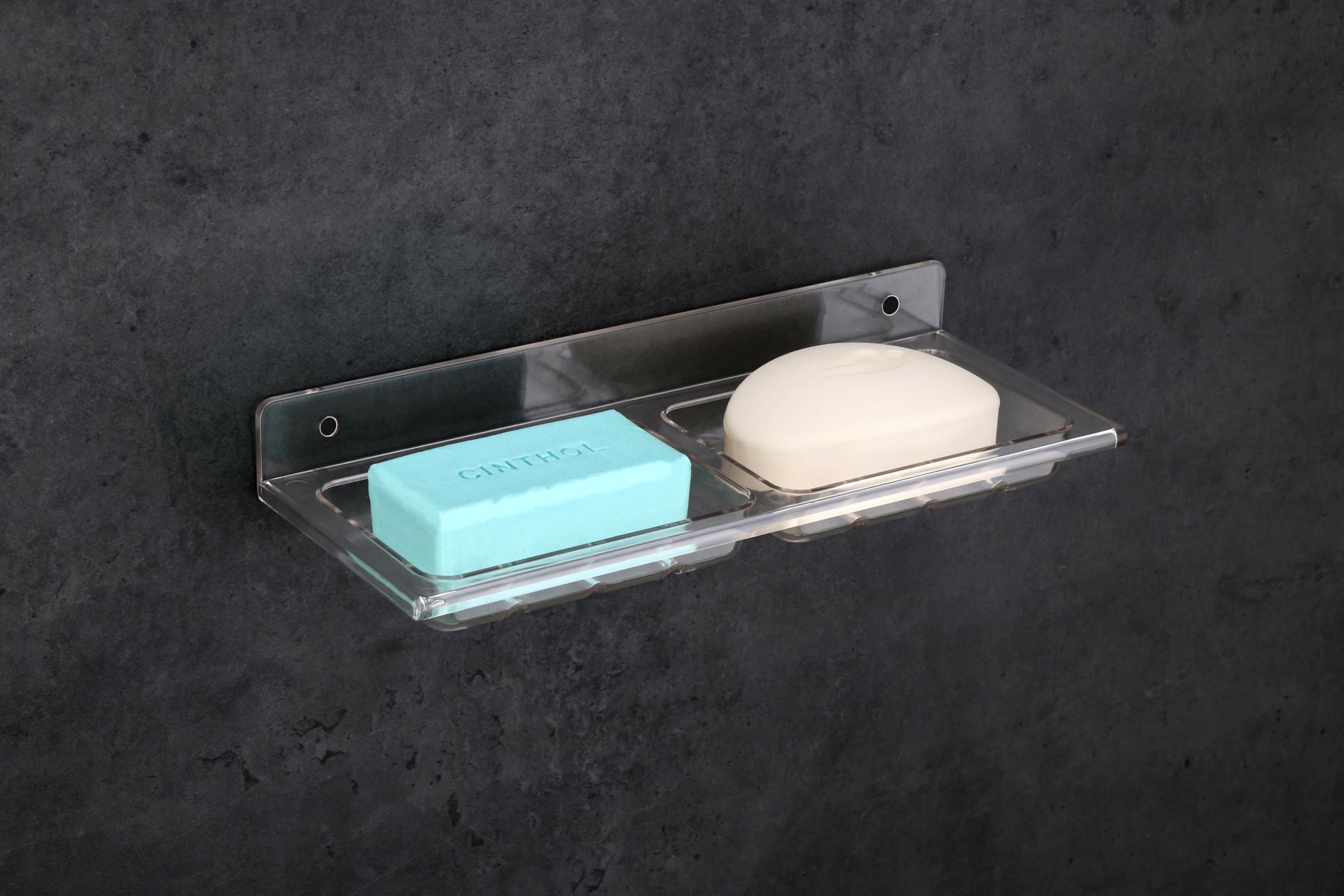 Double soap dish holder mounted on bathroom wall showing proper soap drainage