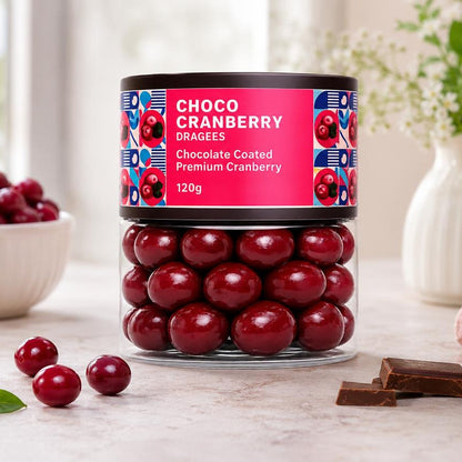 Close-up of vibrant choco cranberry dragees, highlighting their glossy chocolate coating and texture.
