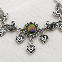 Oxidized Silver Peacock Feather Adjustable Bracelet with Carved Peacock Motifs & Heart Dangles