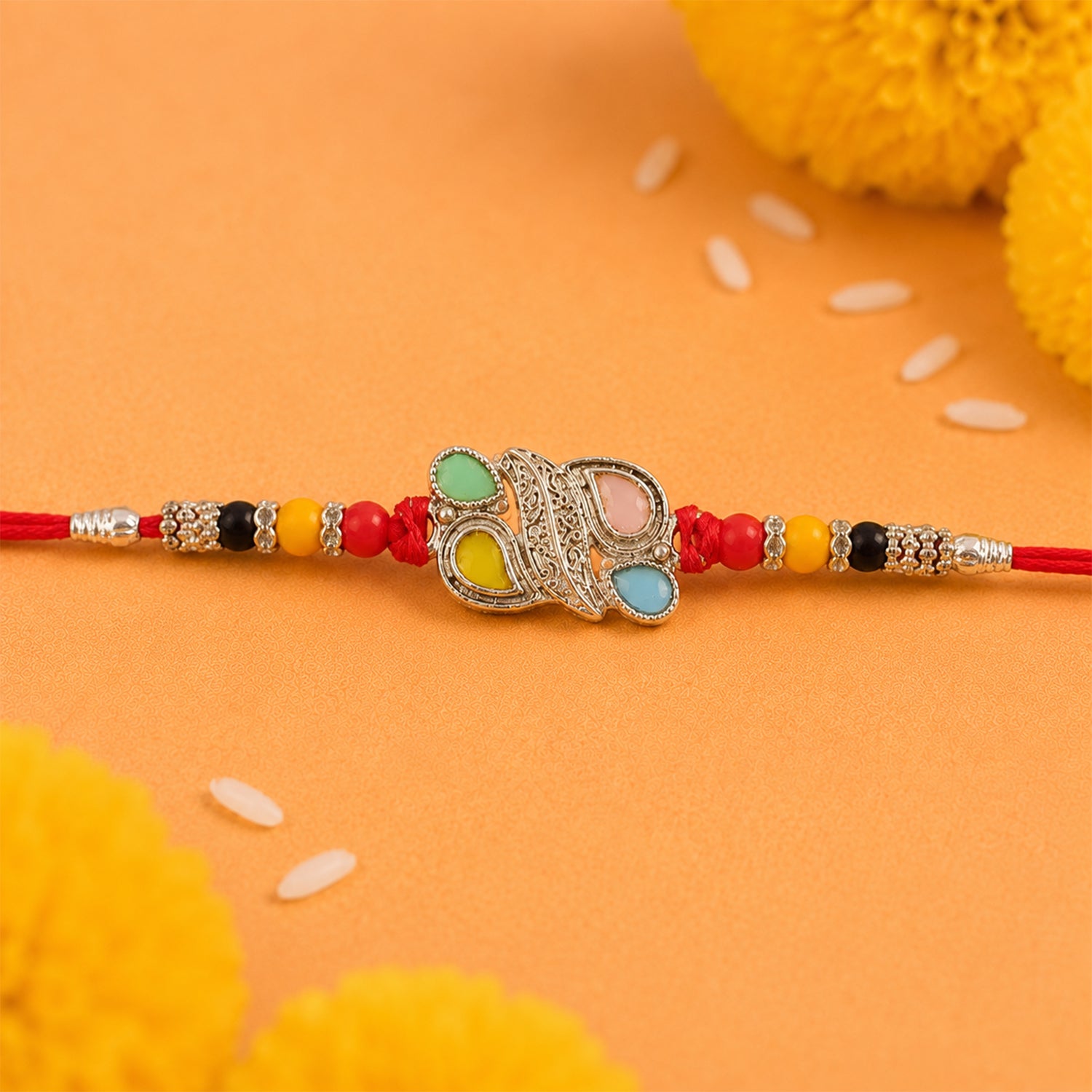 Silver Butterfly Leaf Rakhi with Pastel Stones, Roli Chawal Coin and Card Packing