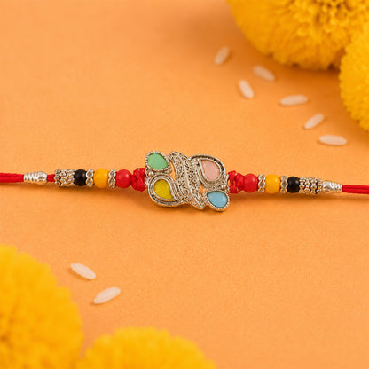 Silver Butterfly Leaf Rakhi with Pastel Stones, Roli Chawal Coin and Card Packing
