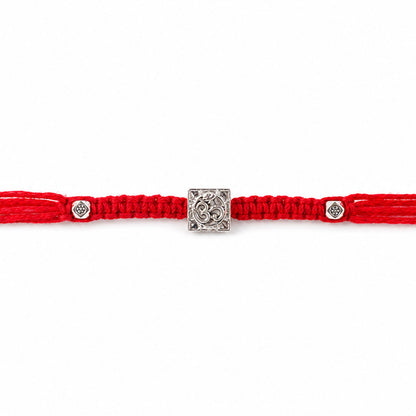 Red Braided Rakhi with Silver Om Pendant Set in a Square Frame