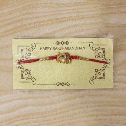 Gold Elephant Rakhi with Red Beads and Pearl Side Detailing