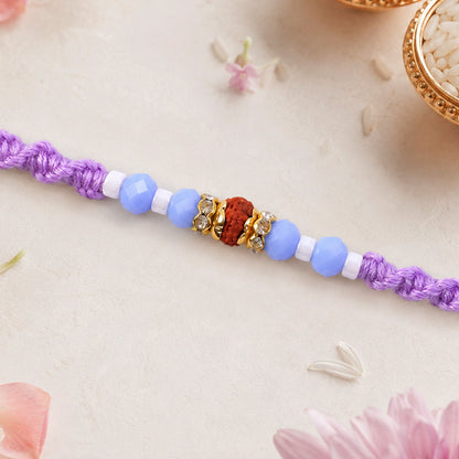 Sparkling Pearl Stone Rakhi with Colorful Thread and Premium Festive Beauty