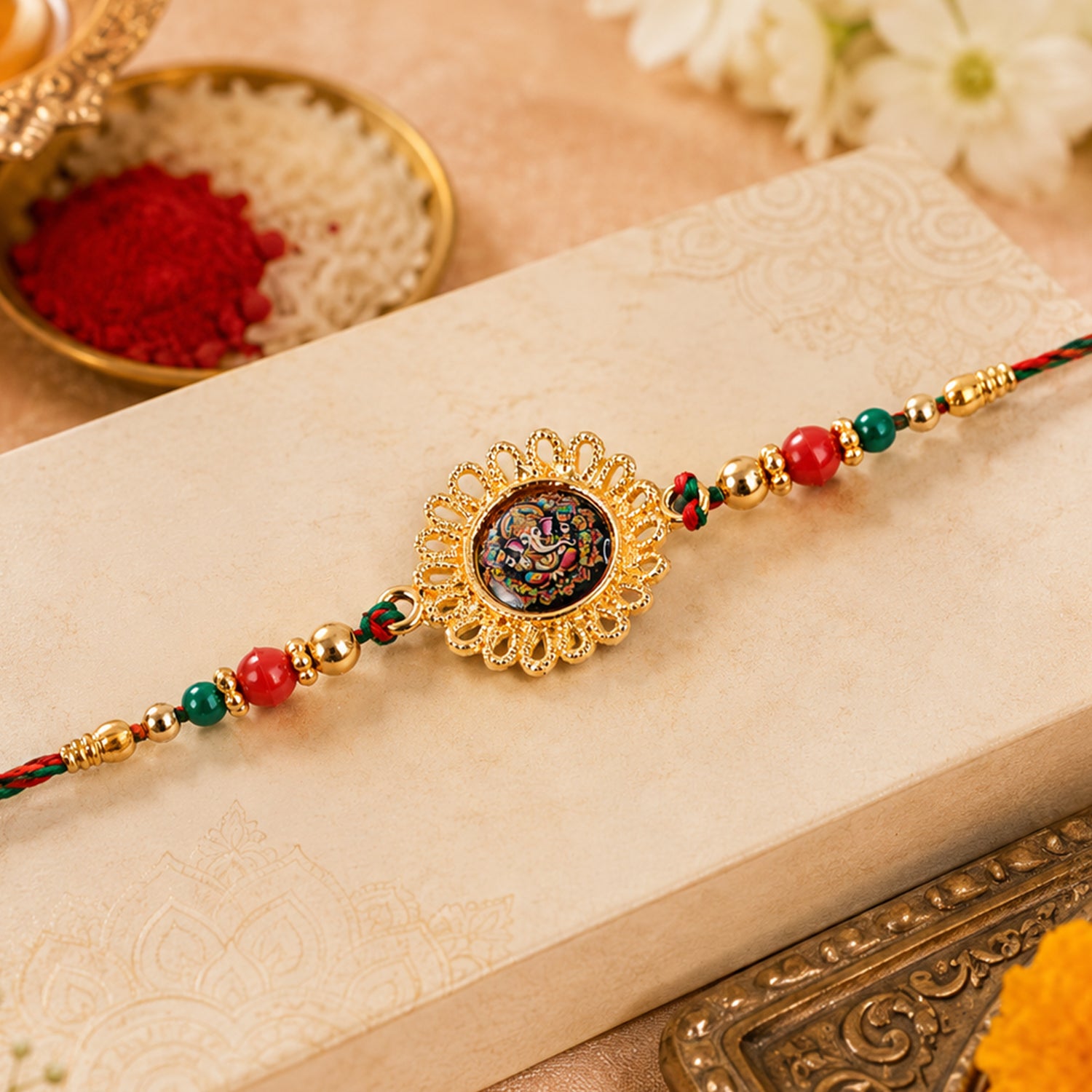 Hand Painted Ganesha Medallion Rakhi with Red Beads