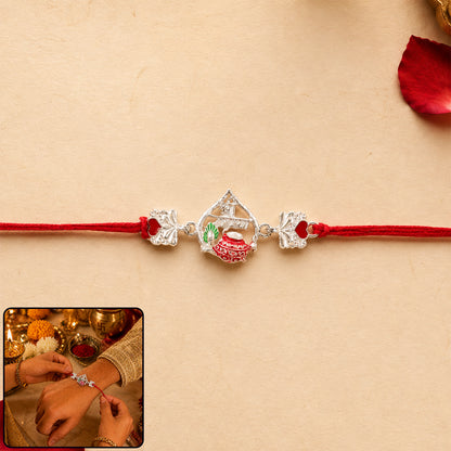 Silver Crown Rakhi with Pink Stone Center and Red Mauli Thread