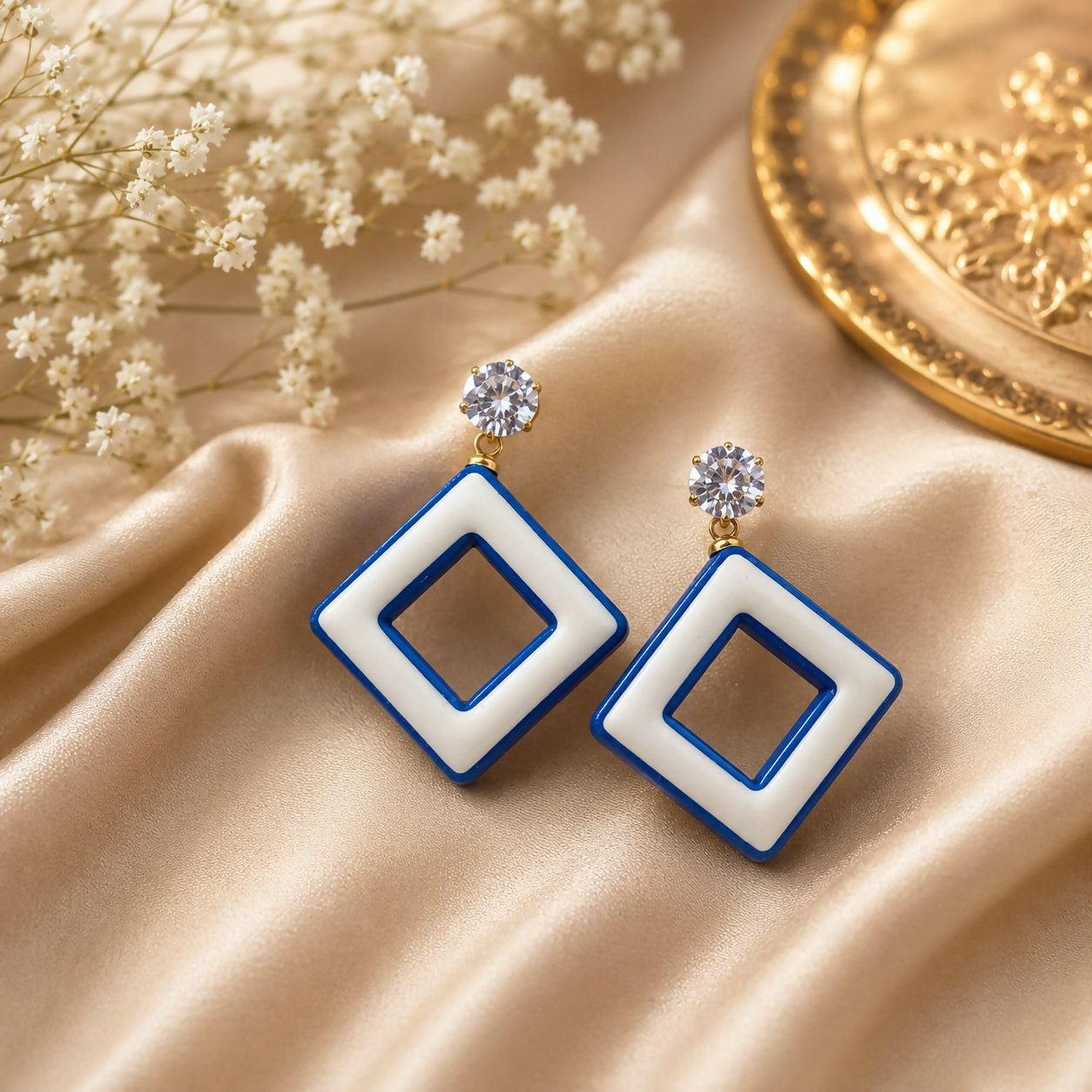 Close-up of a pair of colorful crystal statement earrings.
