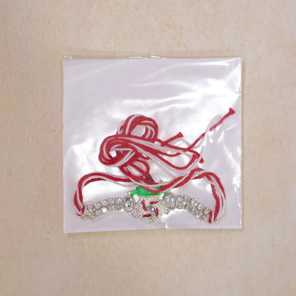Ornate Rakhi with Leaf Floral Charm, multicolor stones and chain look for Festive Use