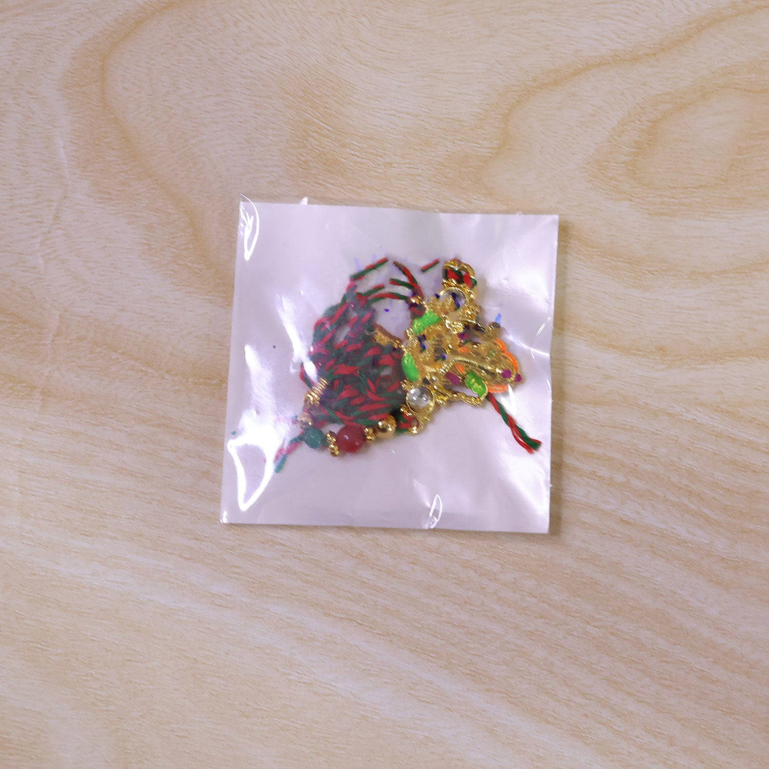 Colorful Ganesh Rakhi with Red Green Beads and Auspicious Festive Gifting Appeal