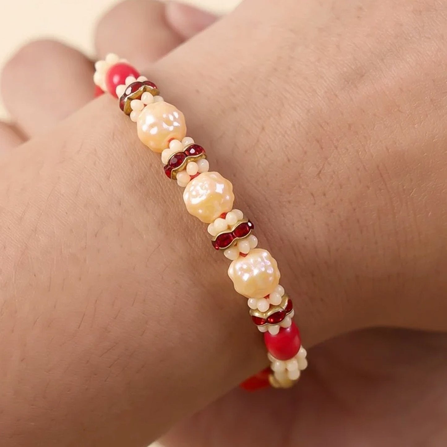 Goden Floral Pearl Beads Crystal Designer Rakhi with Cute Doll Keychain Combo (2 Pc)