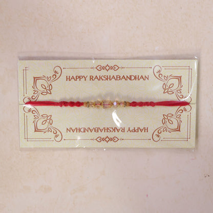 Red Thread Rakhi with Champagne Crystal Beads and Golden Accents