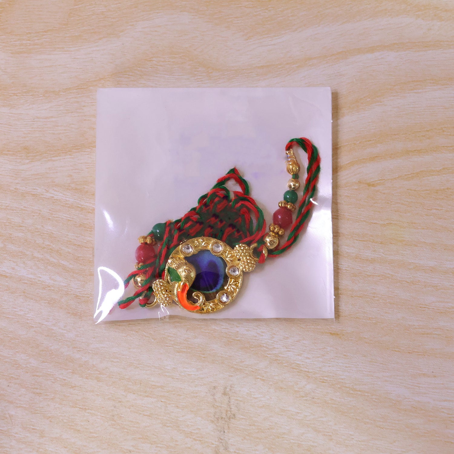 Classic Rakhi with Peacock Circle Charm, leaf touch and thread look for Gift Use