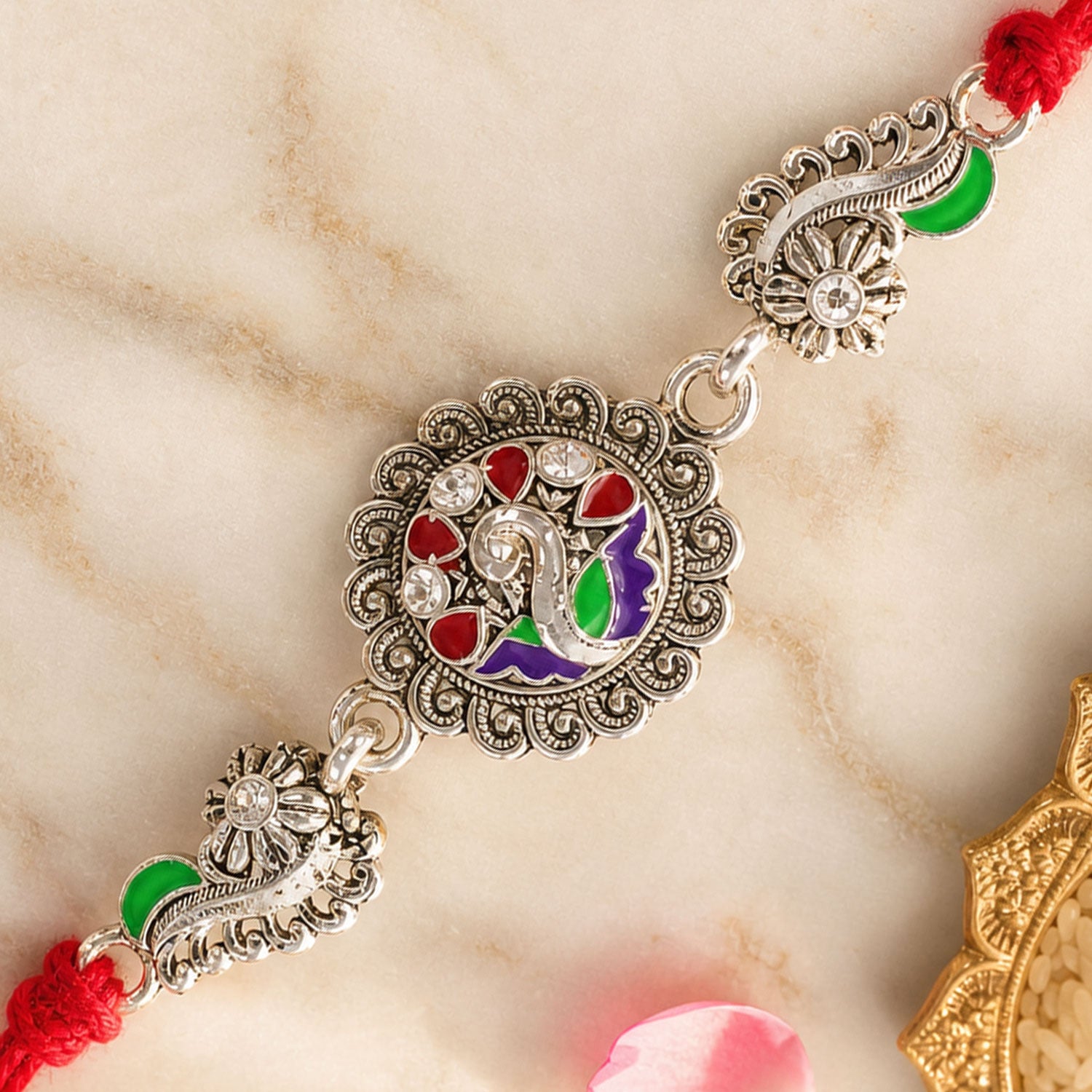 Festive Rakhi showcasing Petal Floral Medallion, pearl accents and bead line for Gift