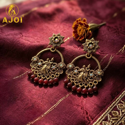 Close-up of floral studs on Radha Krishna chandbali earrings
