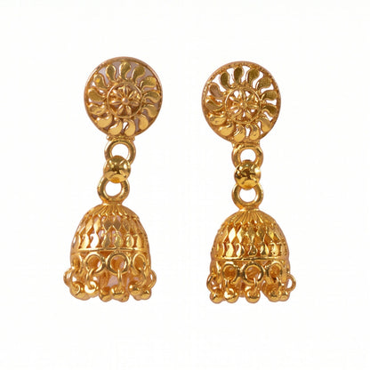 Detailed craftsmanship of gold jhumka earrings with pearls