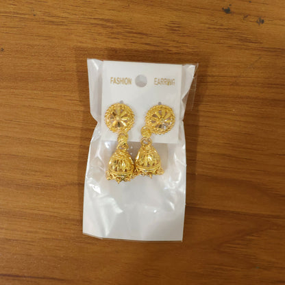 Pair of gold plated floral jhumka earrings on white background