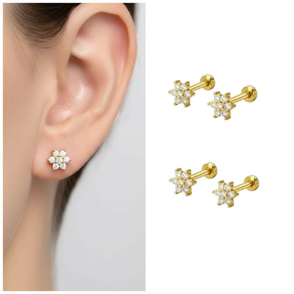 Close-up image of gold plated flower stud earrings with crystal petals and flat back