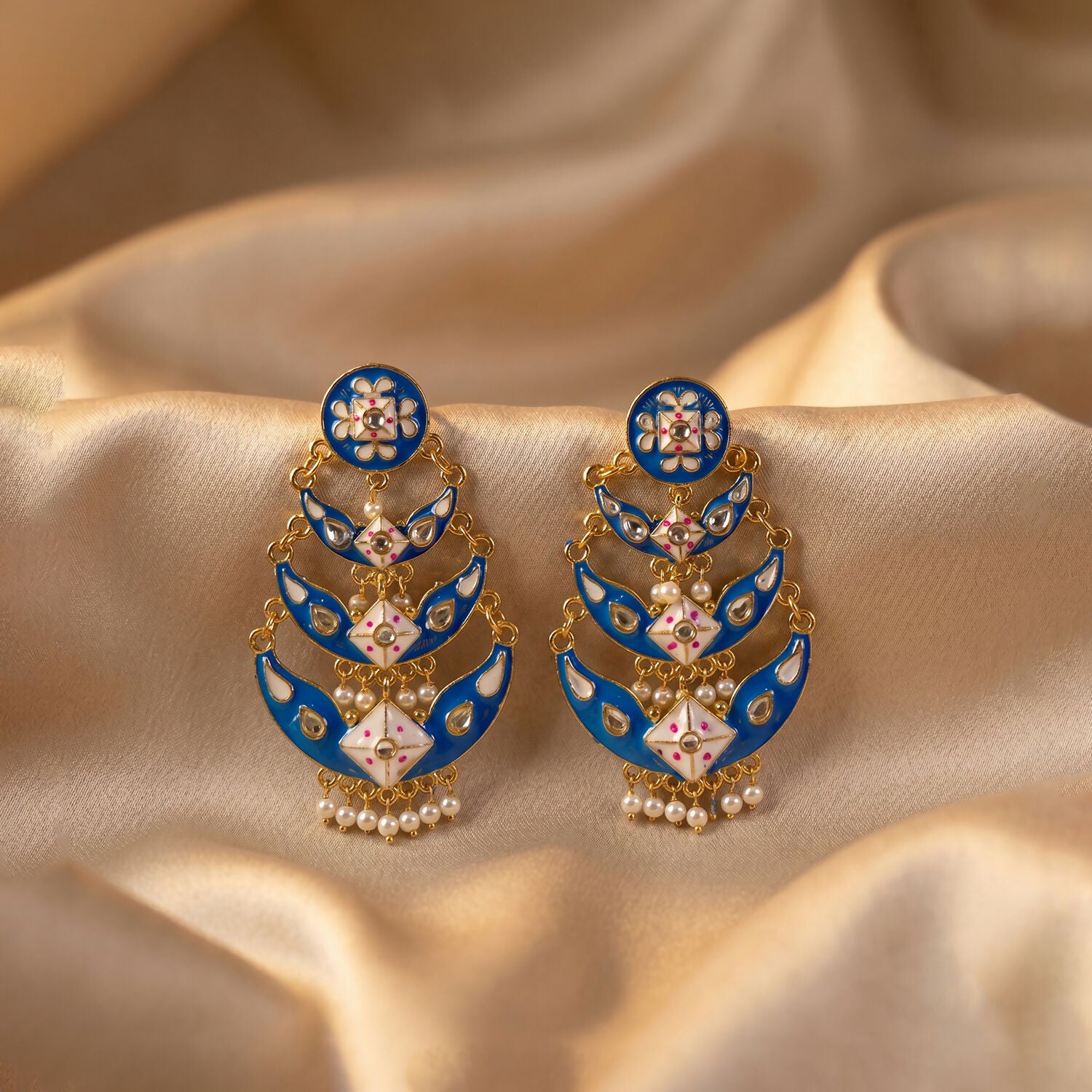 Detailed image of decorative stones on royal blue earrings