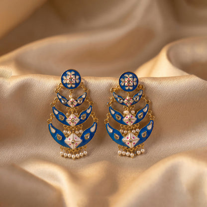 Detailed image of decorative stones on royal blue earrings