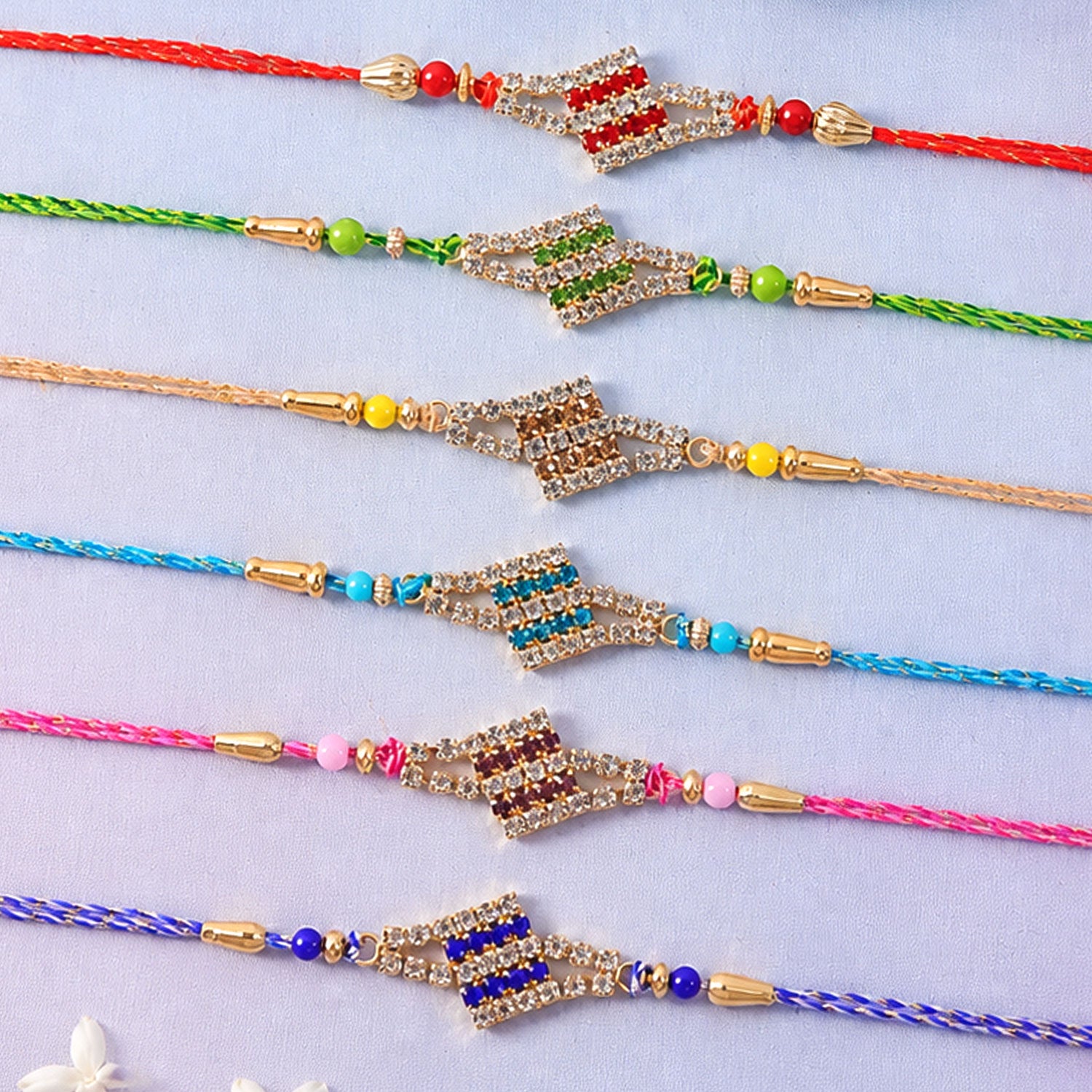 Layered Diamond Motif Rakhi in Mix Colour Threads (Pack of 6)