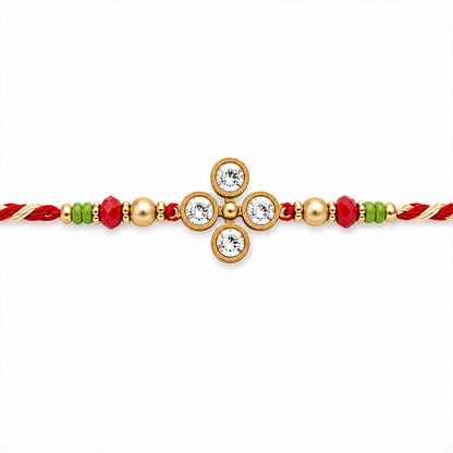 Four Crystal Clover Rakhi with Gold Bezels, Roli Chawal Coin and Floral Gift Packing