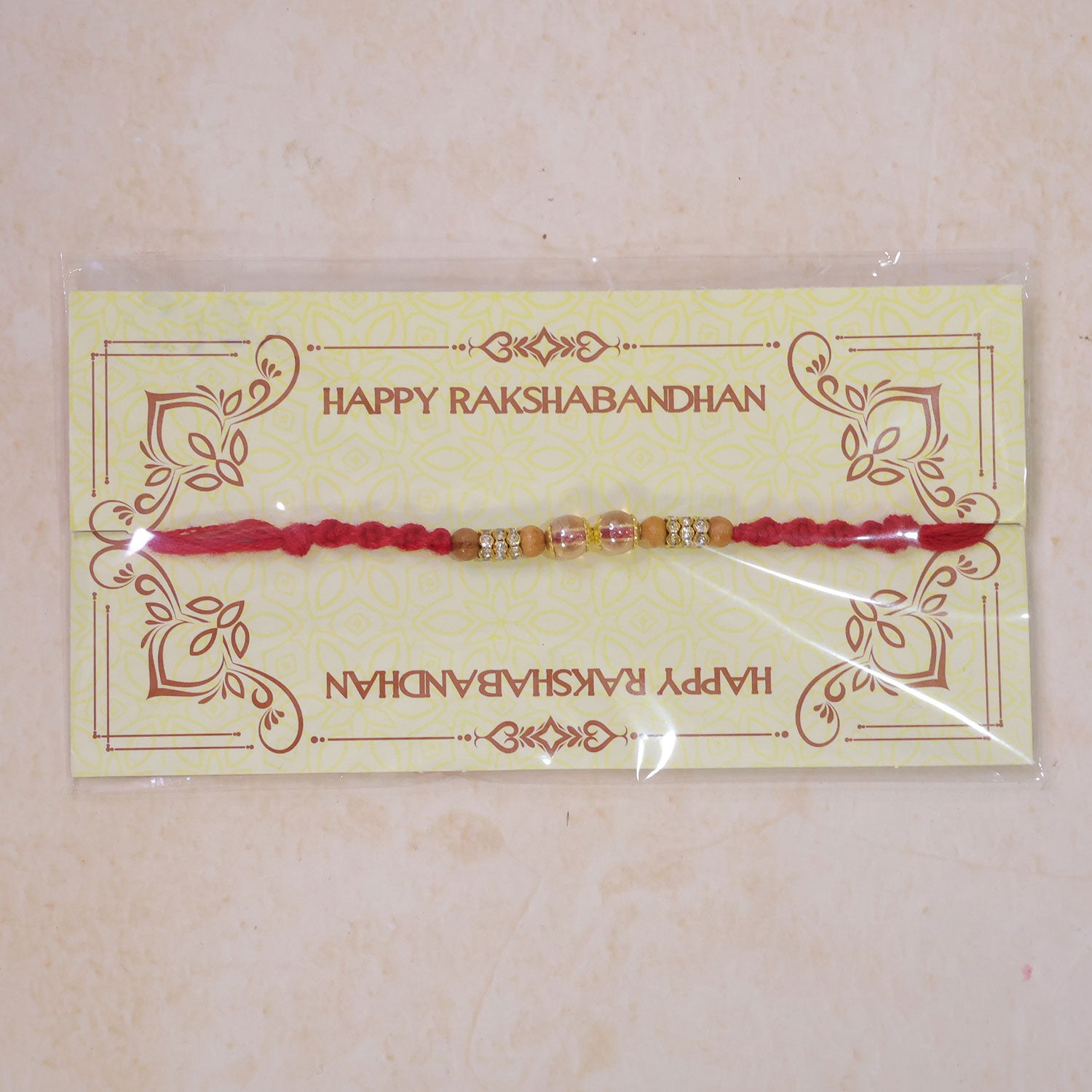 Red Braided Rakhi with Crystal and Natural Wooden Bead Accents