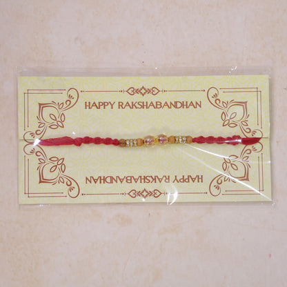 Red Braided Rakhi with Crystal and Natural Wooden Bead Accents