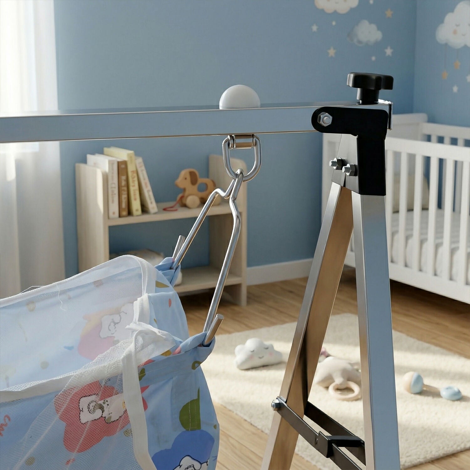 Baby hammock cradle set up in nursery with colorful fabric