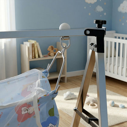 Baby hammock cradle set up in nursery with colorful fabric