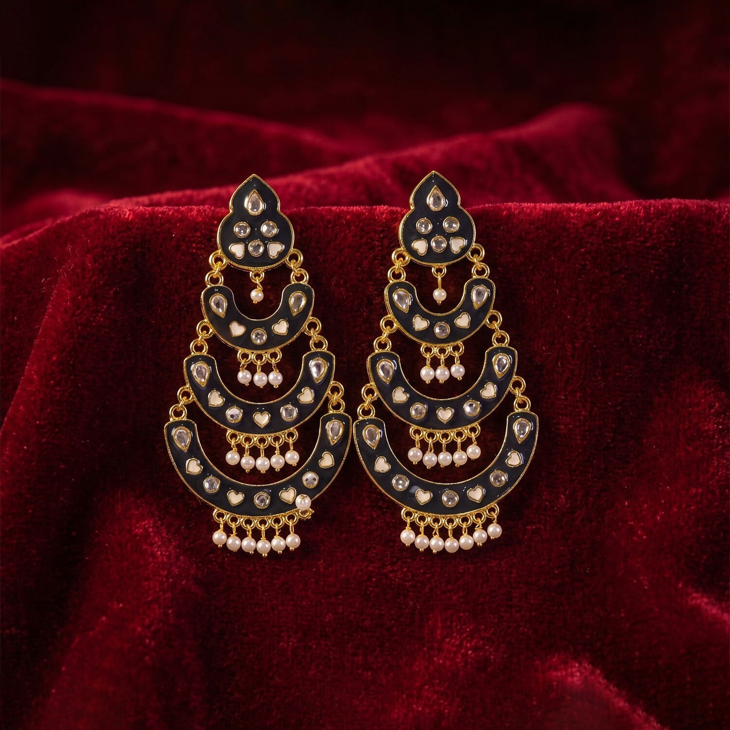 Elegant jhumka earrings featuring pink stones and antique gold dome