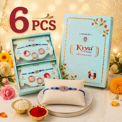 Silver Floral Stone Rakhi with Royal Blue Thread, Roli Chawal Coin and Card Gift Packing