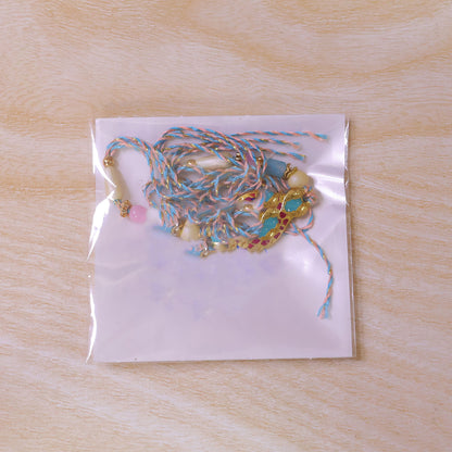 Festive Rakhi with Paisley Heart Charm, blue stones and wrist style for Gift Use