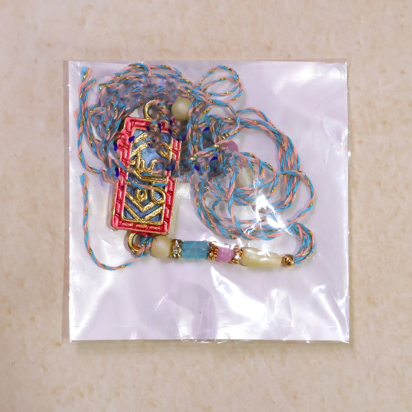 Classic Rakhi showcasing Shubh Plaque, crystal accents and plaque look for Gift Use