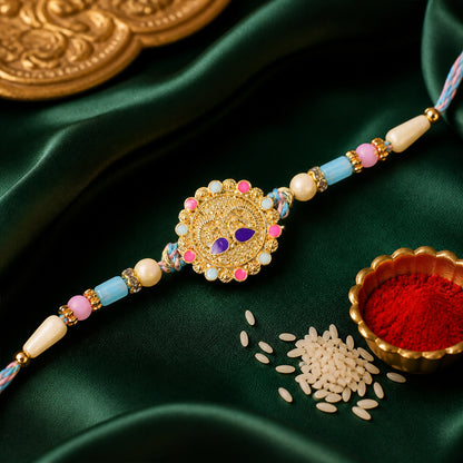 Gold Sunburst Kundan Pendant Rakhi with Pastel Beads