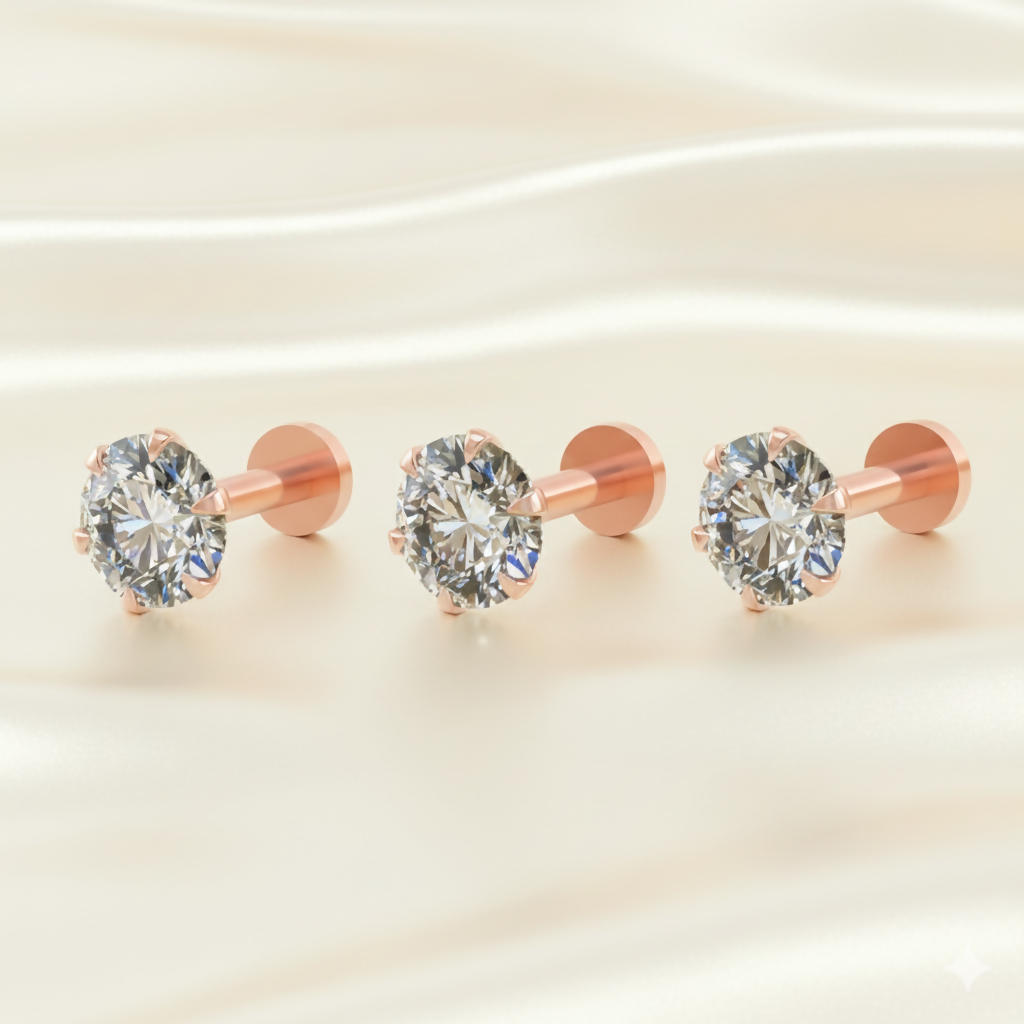 Close-up of tiny rose gold labret stud earring showing cubic zirconia stone