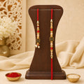 Graceful Circular Medallion Bhai Bhabhi Rakhi with Oval Pendant for Festive Gifting