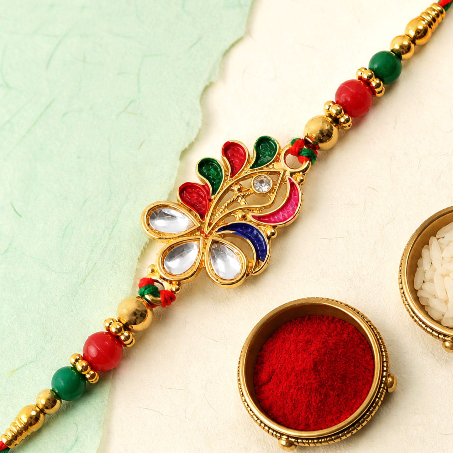 Multicolor Floral Kundan Pendant Rakhi with Green Beads