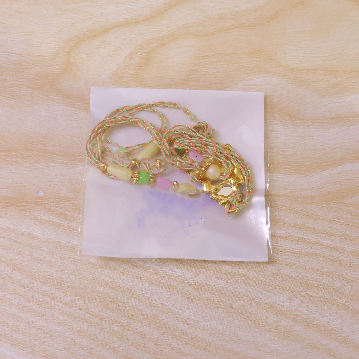 Multicolor Kundan Cluster Pendant Rakhi with Pastel Beads