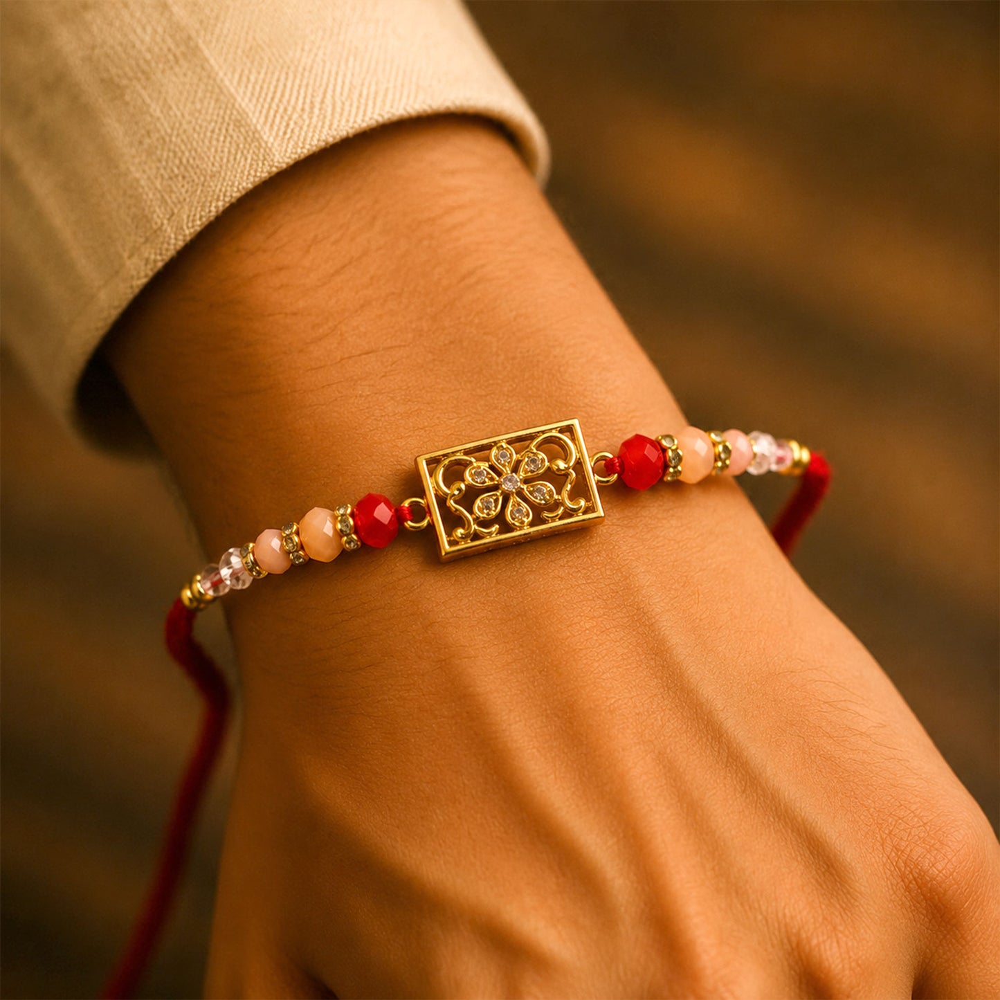 Rectangular AD Filigree Designer Rakhi for Brother with Pink Beads Gift