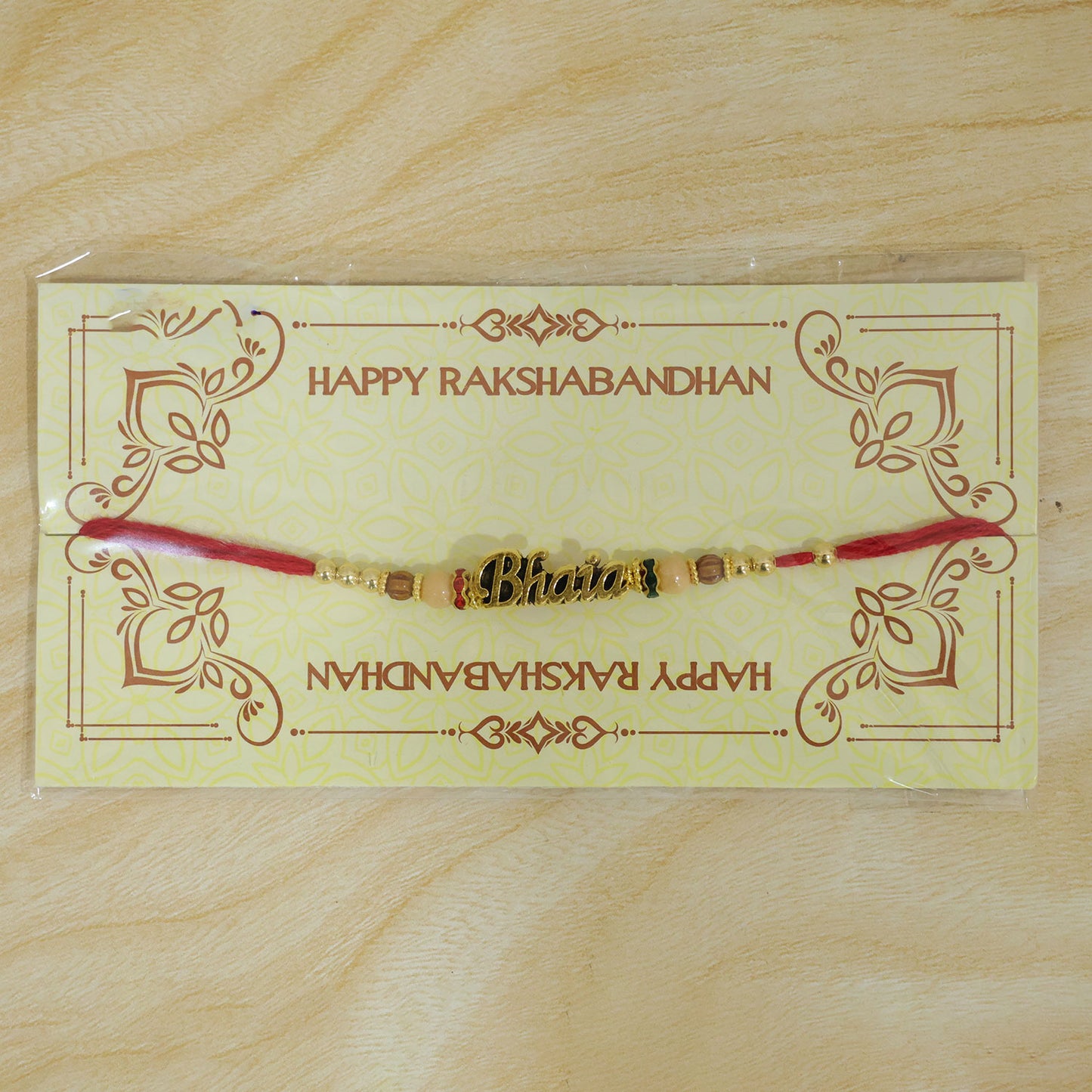Bhaiya Name Golden Rakhi with Peach Brown Beads, Red Thread and Festive Shine