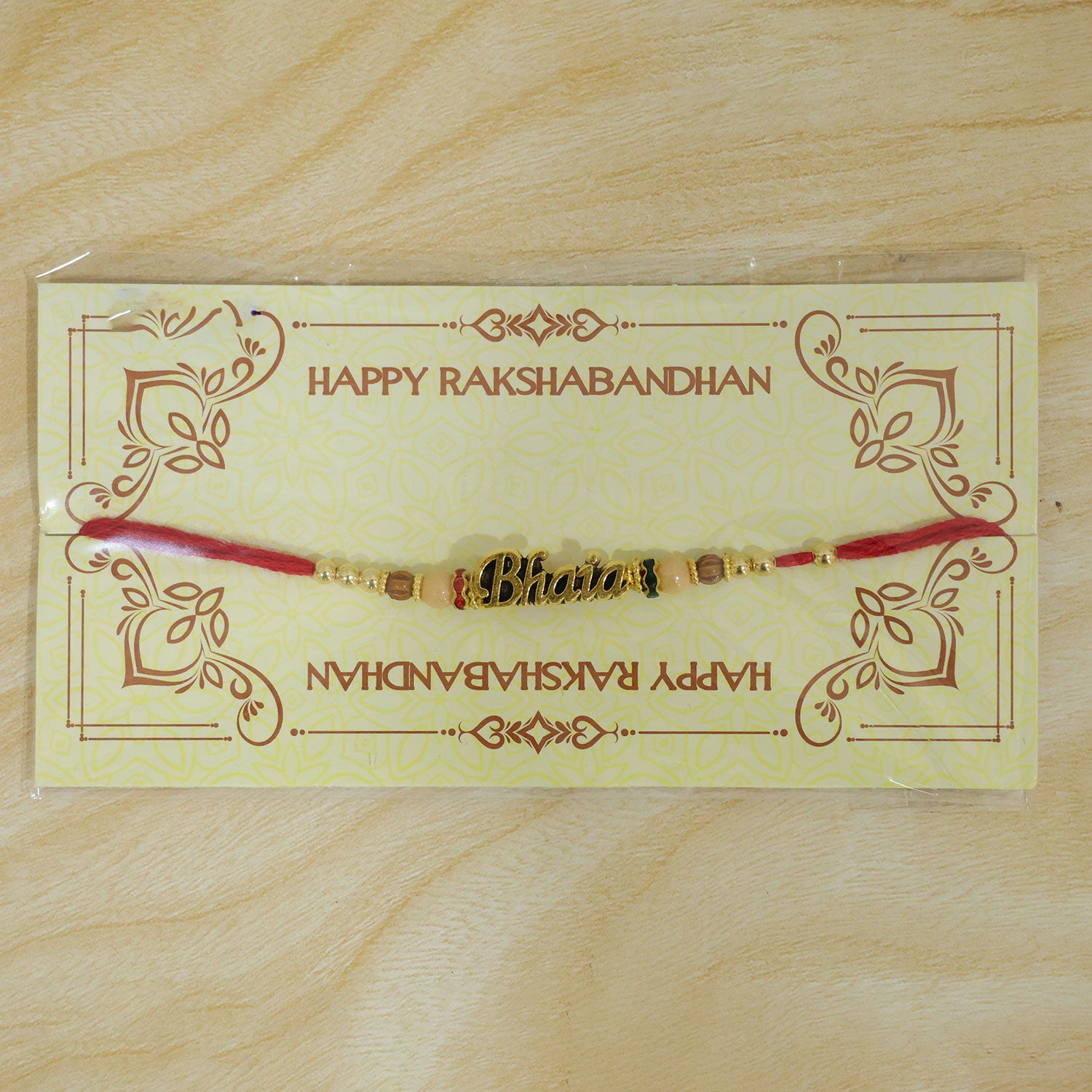 Bhaiya Name Golden Rakhi with Peach Brown Beads, Red Thread and Festive Shine