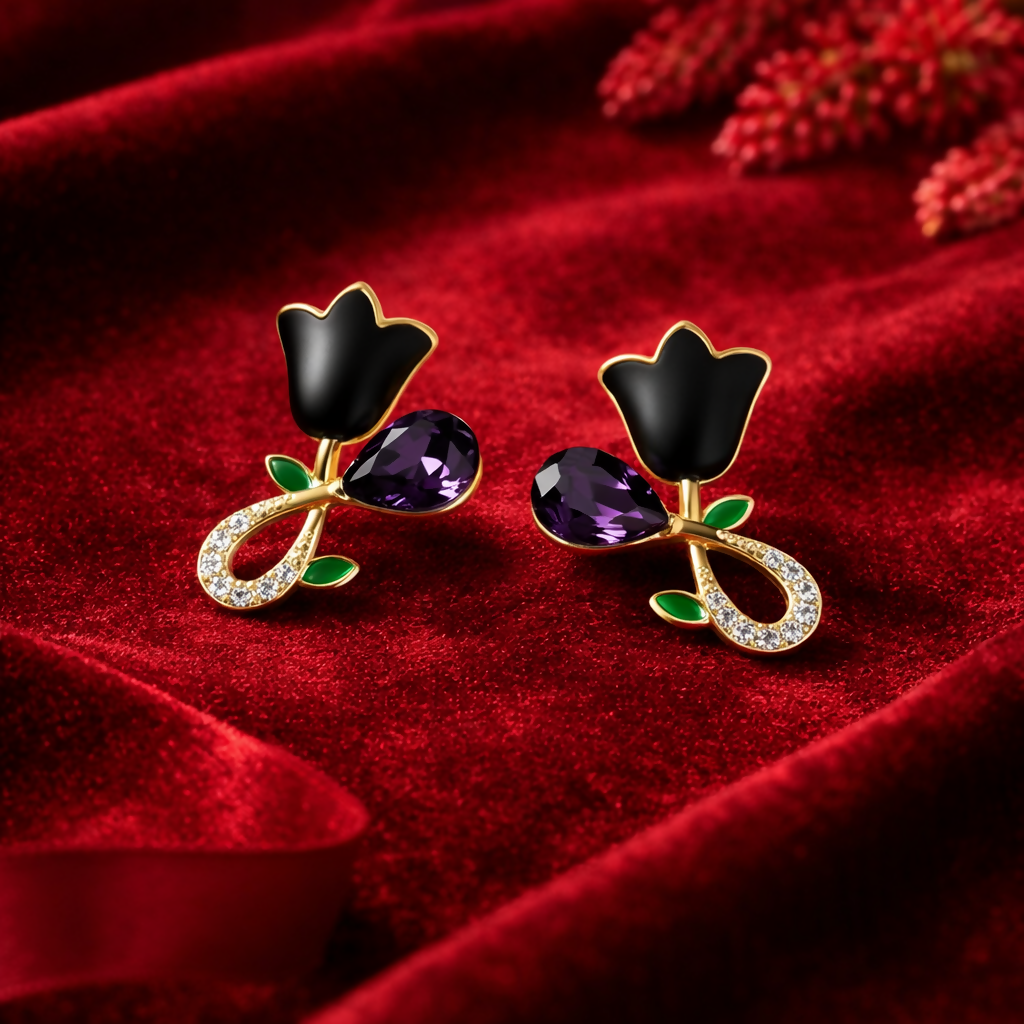 Gold plated black floral stud earrings with detailed leaf accents