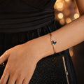 Rose Gold Round Dial Watch with Black Butterfly Charm Bracelet for Women