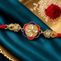 Festive Rakhi showcasing Decorative Rosette, pearl accents and bead line for Gifting