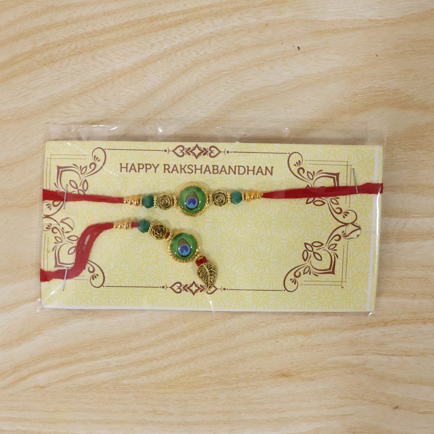 Morpich Bhaiya Bhabhi Lumba Rakhi with Green Beads and Gold Hanging Charm