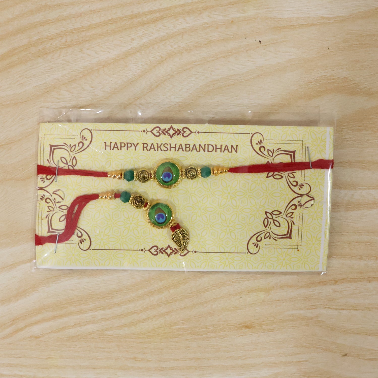 Morpich Bhaiya Bhabhi Lumba Rakhi with Green Beads and Gold Hanging Charm