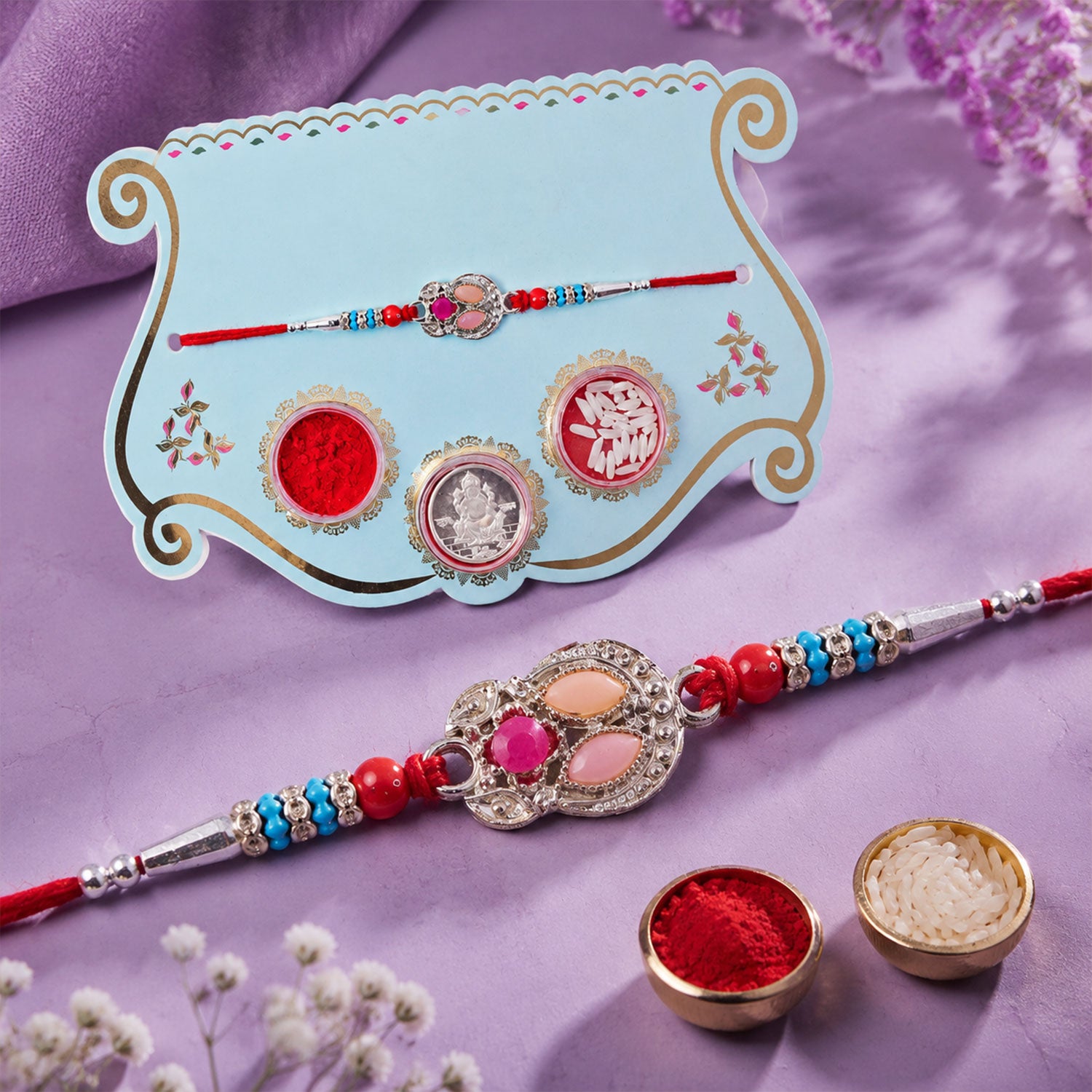 Oval Pink Stone Filigree Rakhi with Red Thread, Roli Chawal Coin and Gift Box Packing