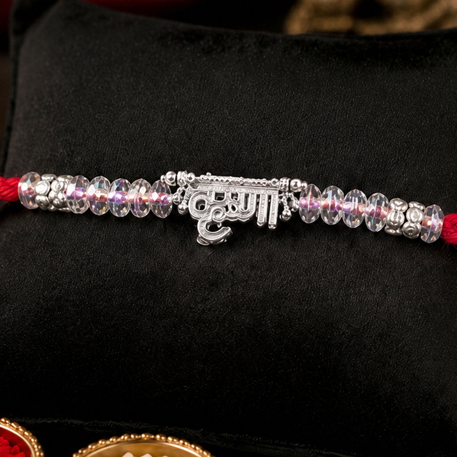 Silver Bhaiya Name Rakhi with Crystal Beads, Red Thread and Sparkling Detail