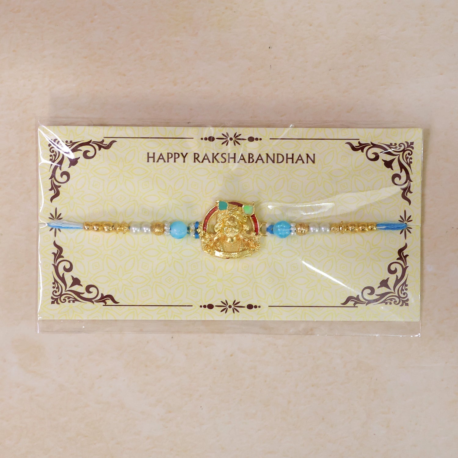 Gold-Toned Khatu Shyam Rakhi with Blue and Pearl Beads for Raksha Bandhan (10pcs)