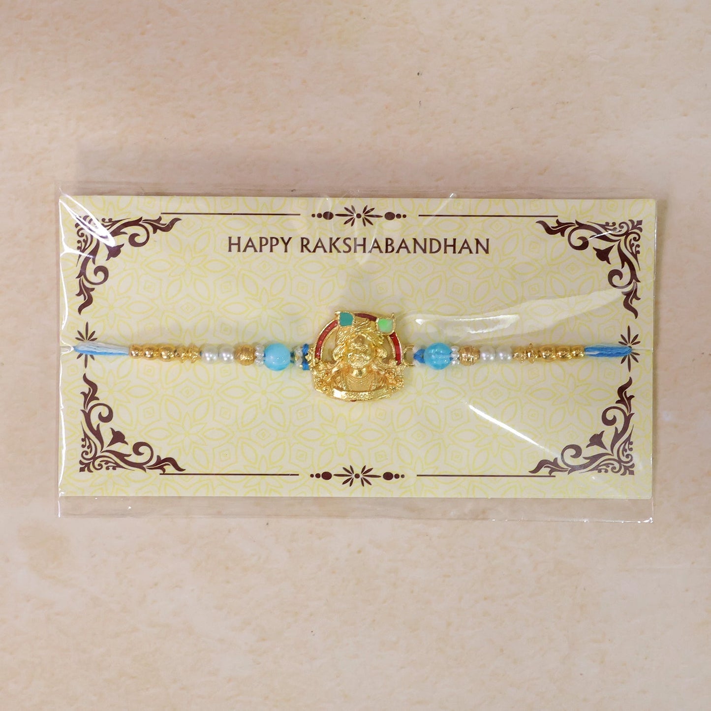 Gold-Toned Khatu Shyam Rakhi with Blue and Pearl Beads for Raksha Bandhan (5pcs)